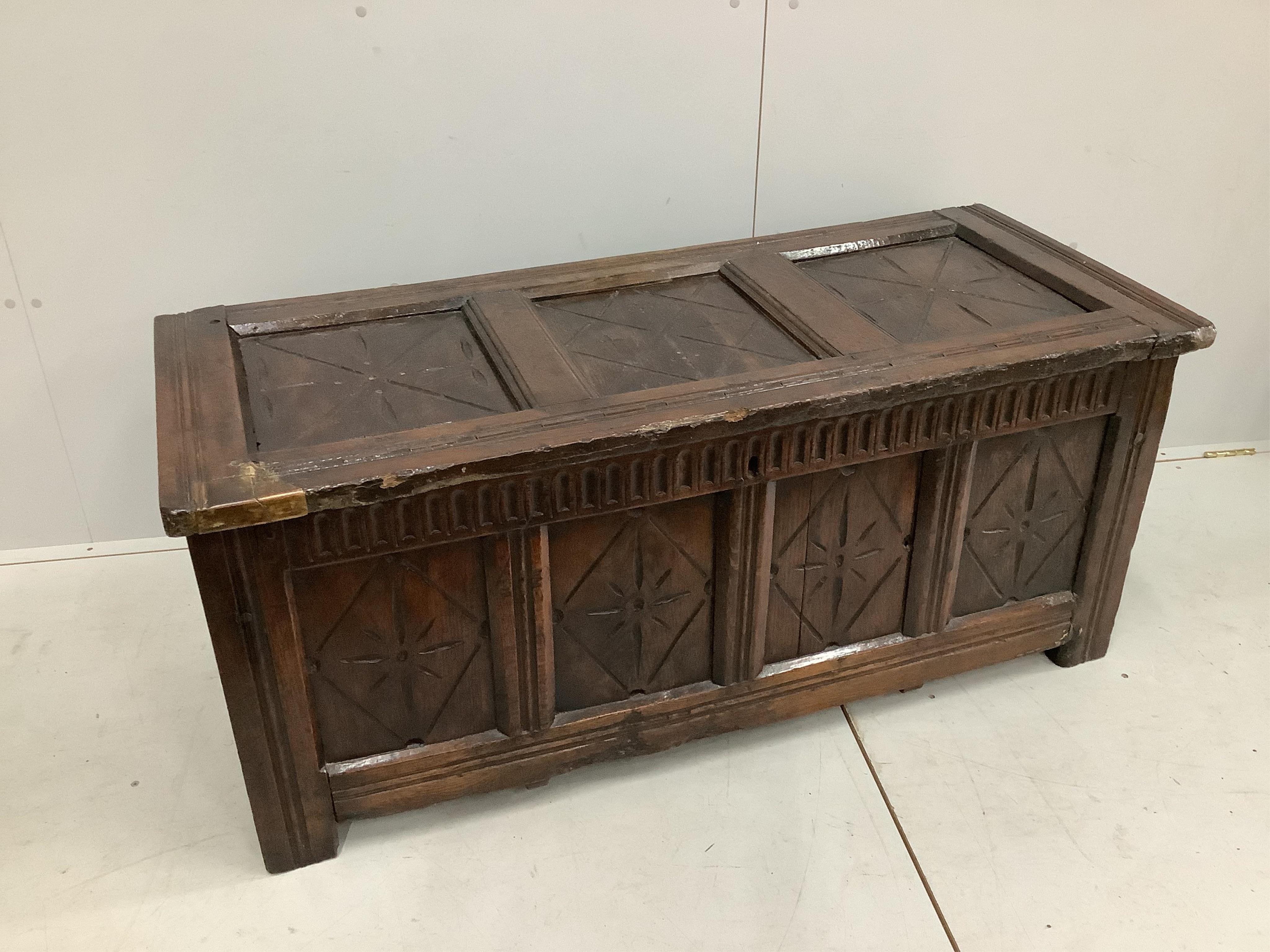 An early 18th century and later oak coffer, width 132cm, height 58cm. Condition - poor